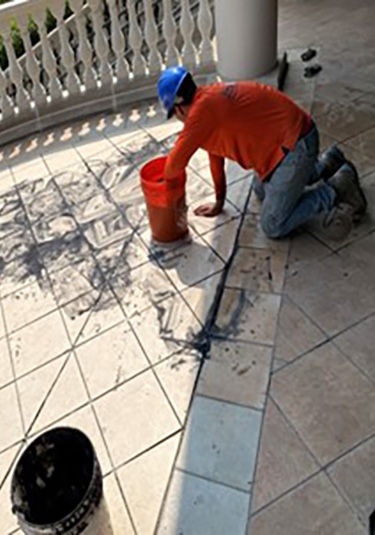Balcony tile replacement in progress