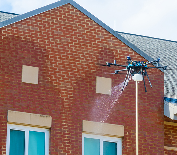 Drone pressure washing