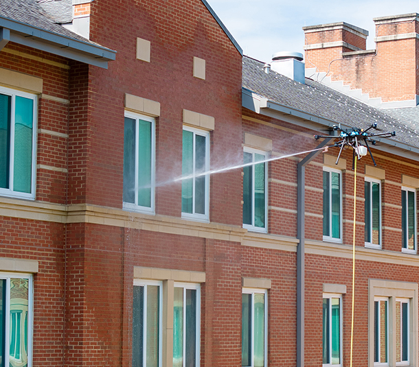 Drone window cleaning in progress