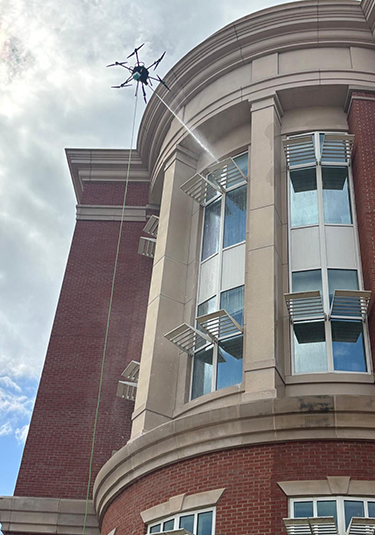 Drone cleaning a university building